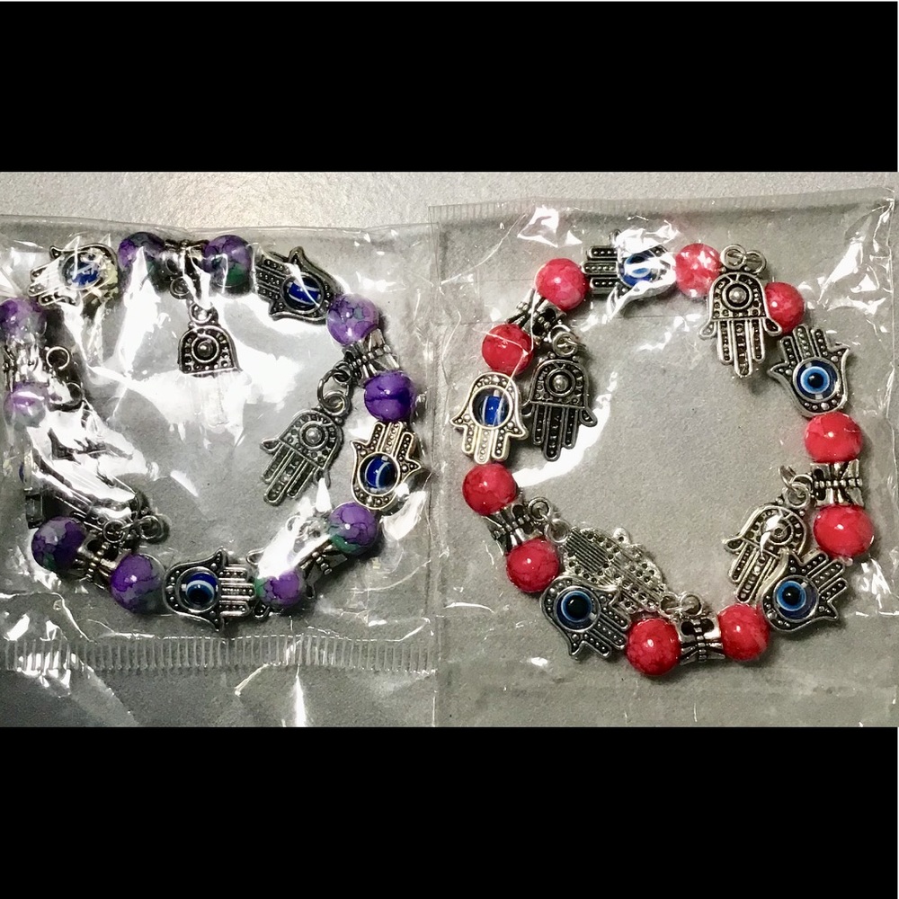 NEW 2 colorful bracelets with hands.
